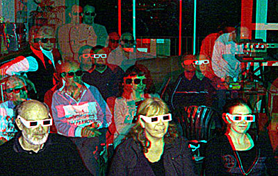 Members of the New Zealand Stereoscopic Society viewing polarised slides with polarised glasses 